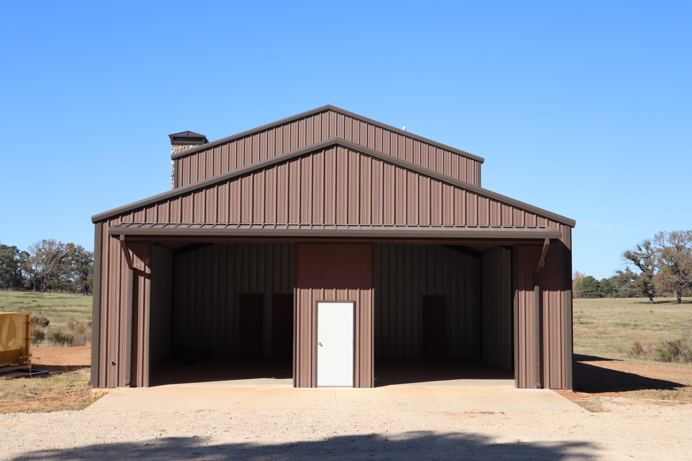 Two-tone metal building with a color-coated roof and matching trim